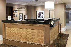 a lobby of a hotel with a reception desk at Hampton Inn Oceanfront Jacksonville Beach in Jacksonville Beach