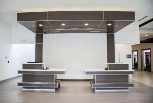 a lobby with two counters in a building at Hilton Garden Inn Tampa Suncoast Parkway in Lutz
