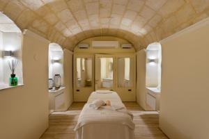 a spa room with two beds and a sink at Domus Zamittello in Valletta