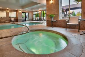 a jacuzzi tub in the middle of a building at Hilton Garden Inn Bozeman in Bozeman