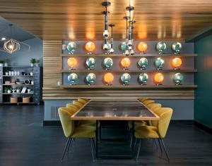 a dining room with a table and chairs at The Wayfarer San Luis Obispo, Tapestry Collection by Hilton in San Luis Obispo