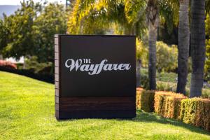 a sign in the grass in a park at The Wayfarer San Luis Obispo, Tapestry Collection by Hilton in San Luis Obispo