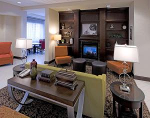 a living room with a couch and a table at Hampton Inn Schenectady Downtown in Schenectady