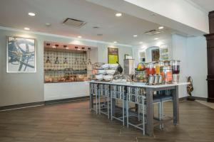 a kitchen with a counter with a bunch of food at Homewood Suites by Hilton Brighton in Brighton