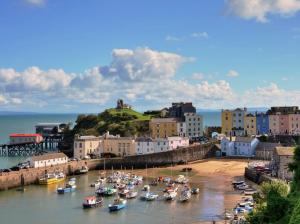 a group of boats in the water in a harbor at Luxury sea-view apartment in Tenby - Floral Corner in Pembrokeshire