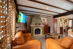 a living room with a couch and a fireplace at Eco-hotel Aire de Monte in Náquera