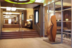a lobby with a statue in the middle of a building at DoubleTree by Hilton Hotel Reading in Reading