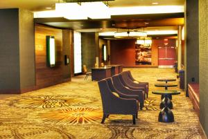 a lobby with a row of chairs and a table at DoubleTree by Hilton Hotel Reading in Reading