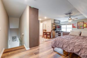 a bedroom with a bed and a dining room at Cozy Covington Studio Rental Near Historic Square! in Covington