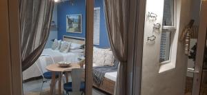 a room with a couch and a table in a room at Milk Thistle Loft & Studio apartments in Paternoster