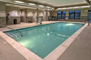 a large pool with blue water in a building at Hampton Inn & Suites Nashville/Goodlettsville Tennessee in Goodlettsville