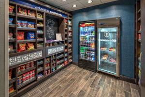 a grocery store aisle with a refrigerator at Hampton Inn & Suites Nashville/Goodlettsville Tennessee in Goodlettsville