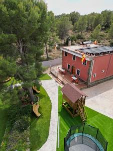 an aerial view of a house with a tree at Eco-hotel Aire de Monte in Náquera