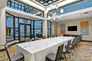 a large conference room with a long table and chairs at The Cincinnatian Curio Collection by Hilton in Cincinnati