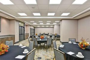 a conference room with black tables and chairs at The Cincinnatian Curio Collection by Hilton in Cincinnati