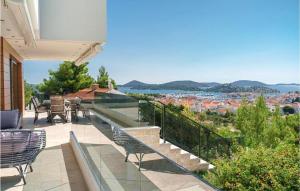 a balcony with chairs and a view of the city at Villa Marko in Tribunj +50 photos
