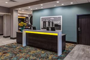 a lobby with a reception desk in a building at Hampton Inn & Suites-Wichita/Airport, KS in Wichita