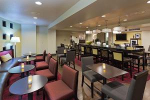 a restaurant with tables and chairs and a bar at Hampton Inn Las Vegas/Summerlin in Las Vegas