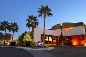 a shopping center with palm trees in front of it at Hampton Inn Las Vegas/Summerlin in Las Vegas