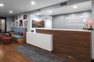 a lobby with a welcome to the age of thesteensteensteensteensteensteen at Hampton Inn Las Vegas/Summerlin in Las Vegas