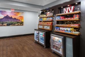 a store with two refrigerators and a painting on the wall at Hampton Inn Las Vegas/Summerlin in Las Vegas