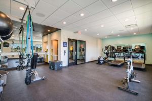 a fitness room with exercise bikes and treadmills at Tru By Hilton Saint Joseph in Stevensville