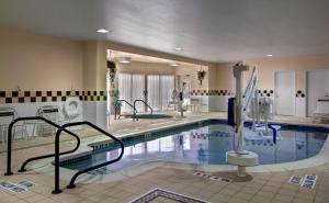 a large swimming pool in a hotel at Hilton Garden Inn State College in State College
