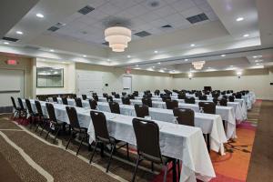 a conference room with white tables and chairs at Hilton Garden Inn Lincoln Downtown/Haymarket in Lincoln +25 photos