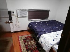 Ліжко або ліжка в номері Mini Home Traveller’s Inn