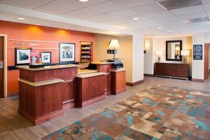a lobby of a hotel with a waiting room at Hampton Inn & Suites Lancaster in Lancaster