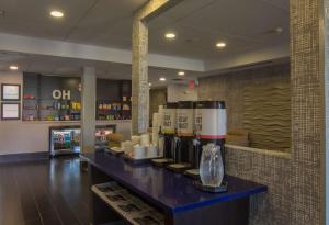 a restaurant with a counter with coffee machines on it at Hampton Inn Medina in Medina