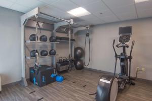 a room with a gym with bikes and weights at Hampton Inn Medina in Medina