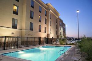 a swimming pool in front of a building at Hampton Inn Las Vegas/North Speedway in Las Vegas