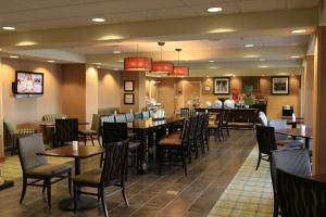 a dining room filled with tables and chairs at Hampton Inn Las Vegas/North Speedway in Las Vegas