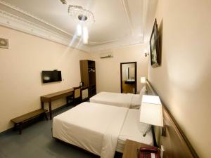 TV a/nebo společenská místnost v ubytování Bon Ami Hotel - Thiên Xuân Hotel