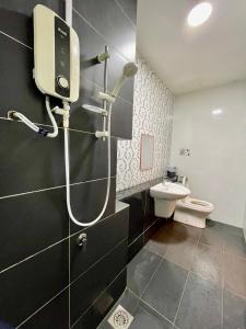 a bathroom with a shower and a toilet at Citywoods 2B2BR - JB Town near HSA, CIQ, Mall - WiFi in Johor Bahru