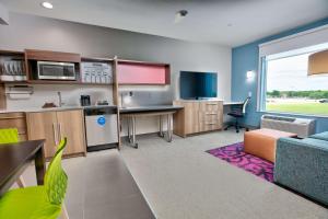 a room with a kitchen and a living room at Home2 Suites By Hilton Wichita Falls, Tx in Wichita Falls