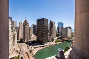 a view of a city with a river and buildings at LondonHouse Chicago, Curio Collection by Hilton in Chicago