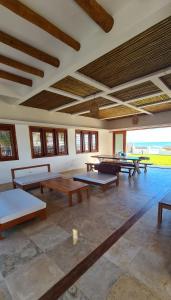 a large room with ping pong tables in it at Villa Continentes Brasil & Maison de rêve sur la plage in Guajiru