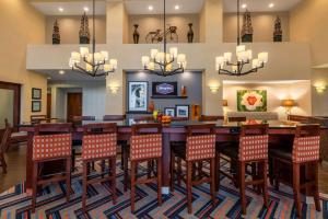 a dining room with a large table and chairs at Hampton Inn & Suites Hopkinsville in Hopkinsville