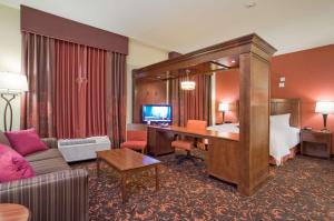 a large hotel room with a bed and a desk at Hampton Inn & Suites New Braunfels in New Braunfels
