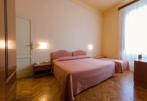 Postel nebo postele na pokoji v ubytování Hotel Reale