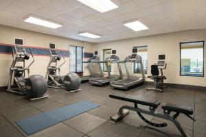 a gym with several treadmills and cardio machines at Hampton Inn Reading/Wyomissing in Wyomissing