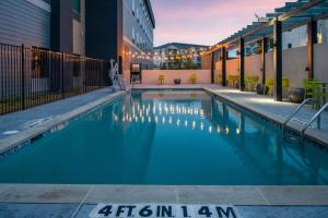 a swimming pool in the middle of a building at Home2 Suites By Hilton Rowlett Rockwall Marina in Rowlett