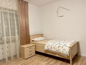 a small bedroom with two beds and a dresser at Casa Giulia in Gleiberg