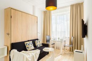 a living room with a couch and a table at ShortStayPoland Aleje Jerozolimskie in Warsaw +29 photos