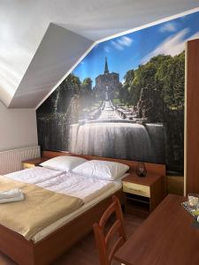 een slaapkamer met een grote muurschildering van een waterval bij Deutsches Haus Livno in Livno