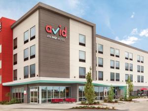 an office building with a sign on the side of it at avid hotels Traverse City, an IHG Hotel in Traverse City