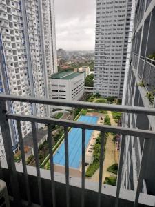 a view from the balcony of the apartment building at CASA UNO By Mojo's Staycation in Manila