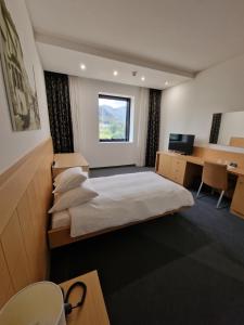 Postel nebo postele na pokoji v ubytování Hotel Coronado